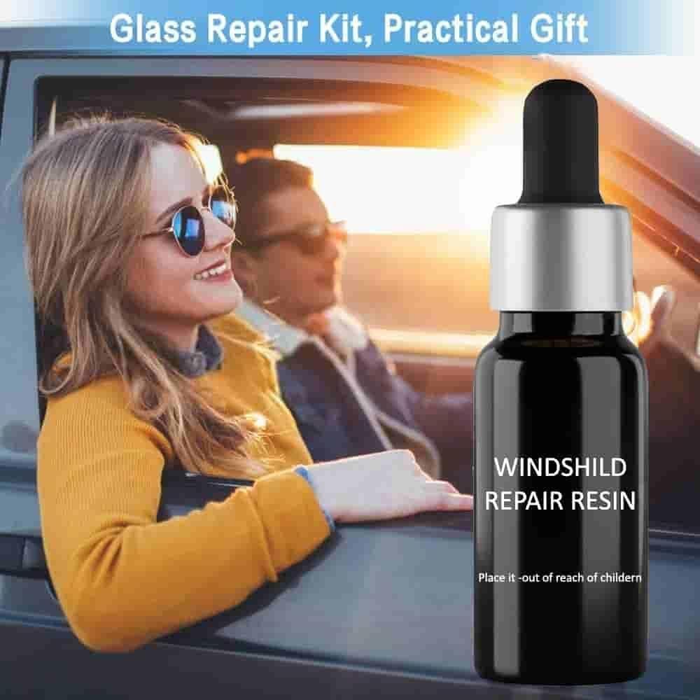 Black windshield repair resin bottle next to smiling couple in car showing glass repair kit for car windshield