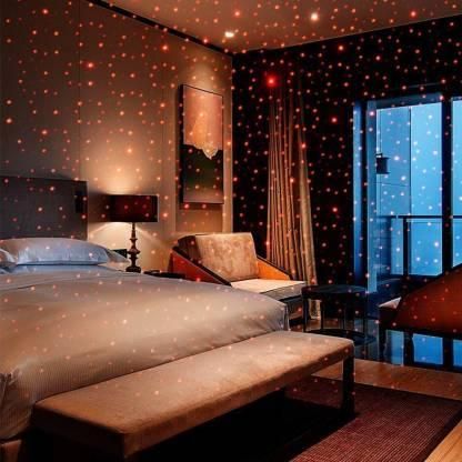 Cozy bedroom featuring a car star ceiling light creating a starry atmosphere with colorful lights