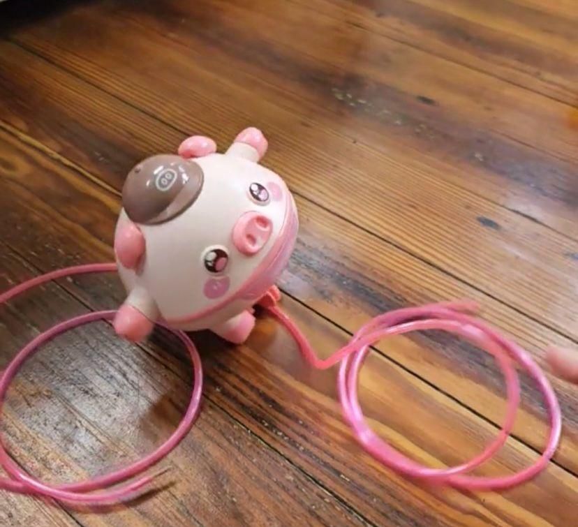 Children's tightrope walking toy designed as a cute pig with colorful ropes for balance and fun