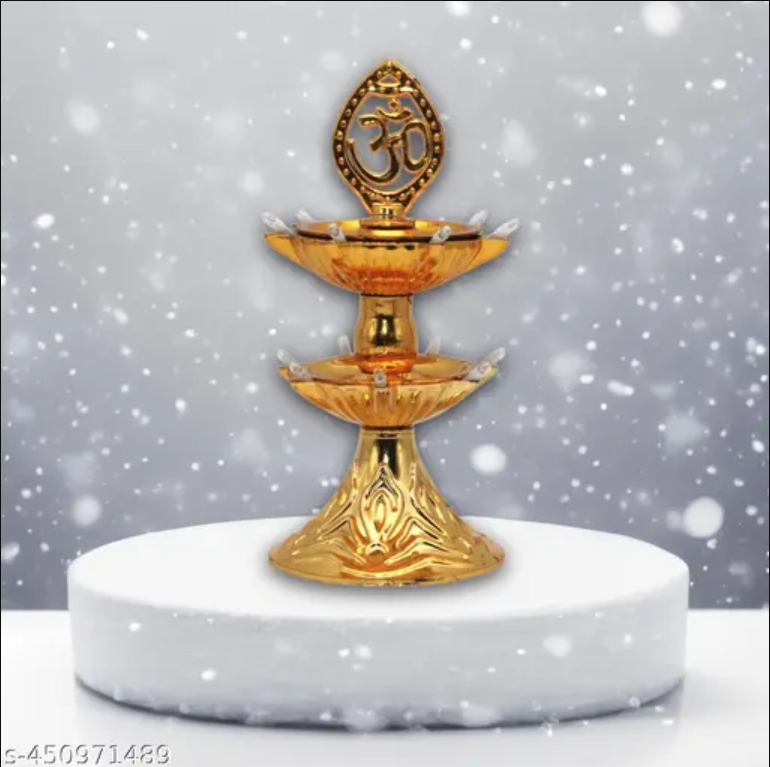 Golden two tier brass oil lamp with Om symbol and four wick holders decorative diya for Diwali pooja