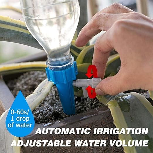 Hand adjusting valve on bottle drip stake in soil beside succulent self-watering system for indoor plants automatic irrigation