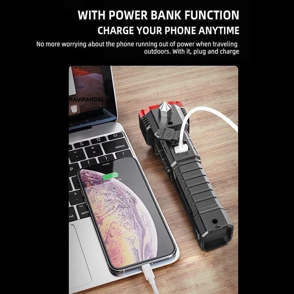 Black rugged portable multi function torch with power bank charging a smartphone via USB on wooden table