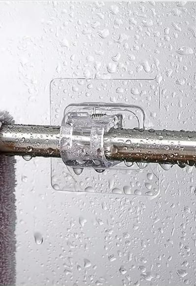 Self adhesive rod clips for easy towel hanging in a bathroom with waterproof design