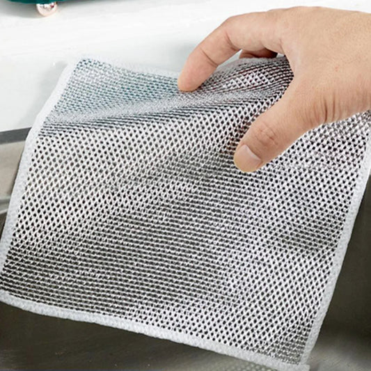 Hand holding gray mesh kitchen cloth above sink multipurpose microfiber cleaning cloths for counters and dishes