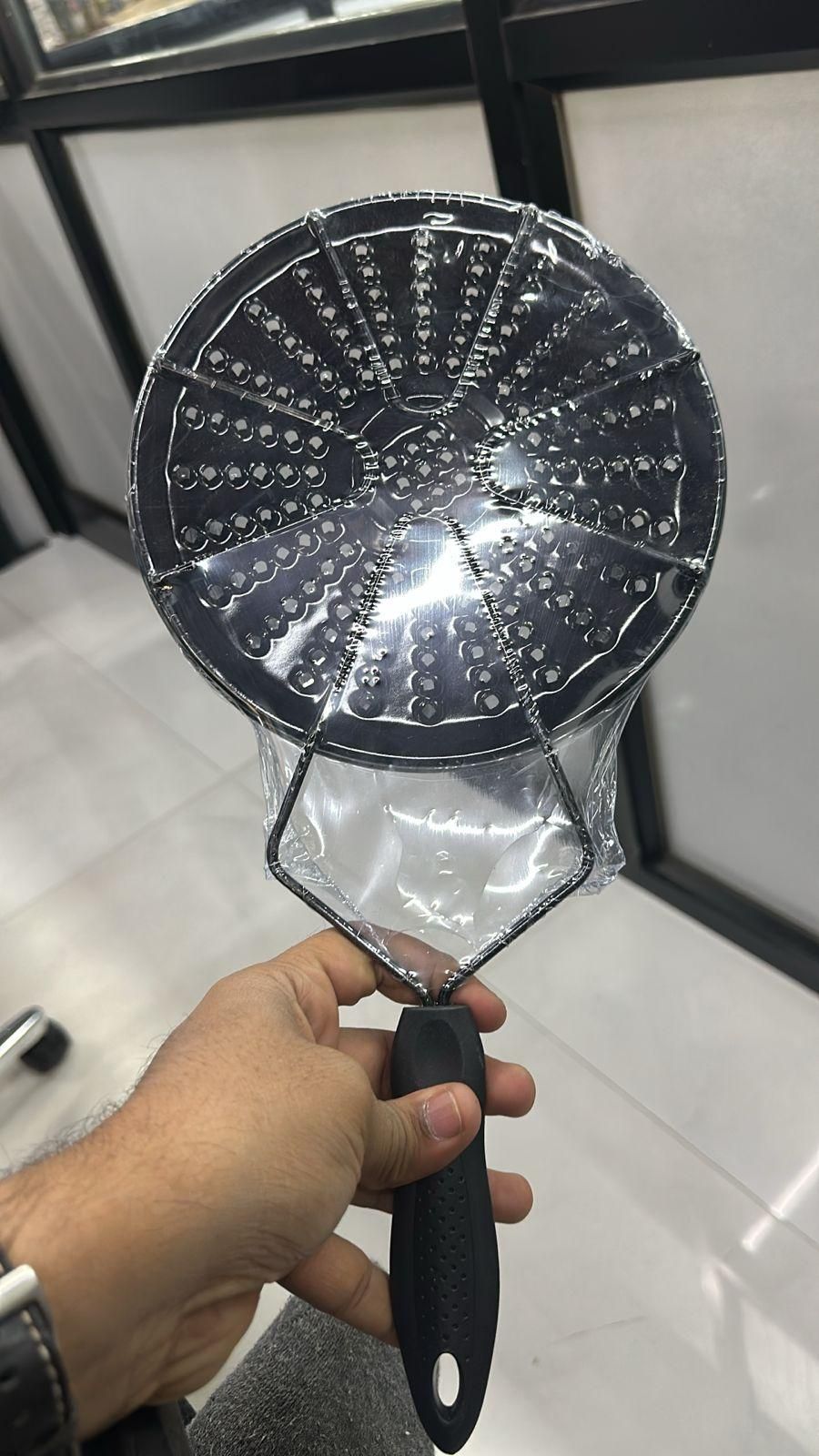 Handheld gas and electric stove diffuser with a perforated surface for even heat distribution